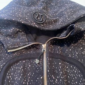 Lululemon Hoodie. Black pattern with brass color zipper. Like new.